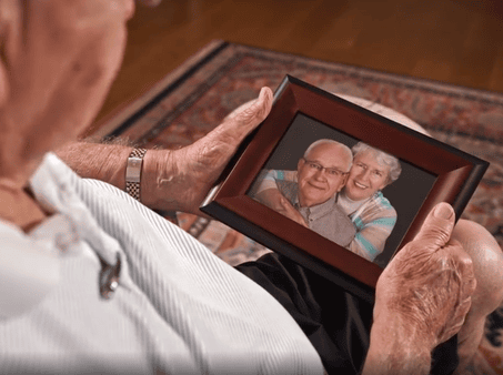 resident holding picture frame
